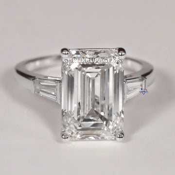 Best selling solitaire diamond ring in 14 kt white gold with vvs clarity diamonds in emerald and tapered baguette Gurukrupa-Gems