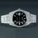 Make a bold statement in hip-hop fashion with fully iced-out moissanite diamond watch, showcasing a sleek black dial